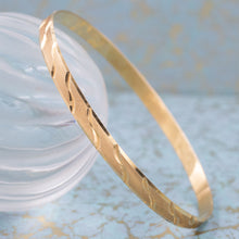 Gold Bangle with Wavy Cut Pattern