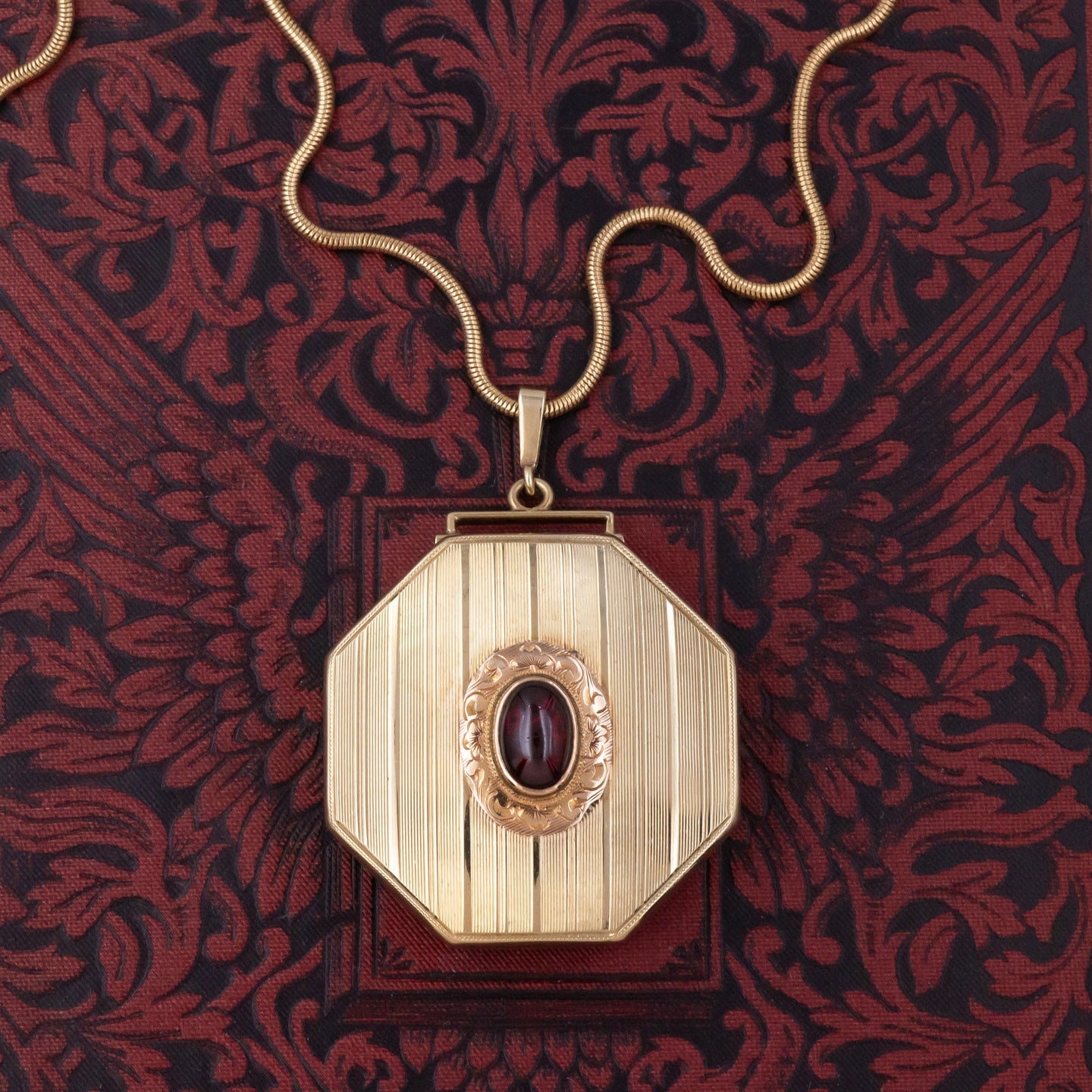 Gold Locket with Garnet Cabochon c1910