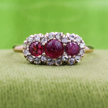 Three Stone Ruby Ring with Rose Cut Diamond Halo c1900