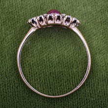 Three Stone Ruby Ring with Rose Cut Diamond Halo c1900