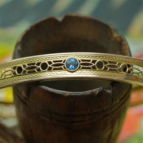 Elegantly pierced Edwardian 14k oval bangle with diamond and sapphires