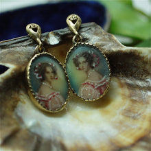 Circa 1930s 14k portrait earrings with hand painted details